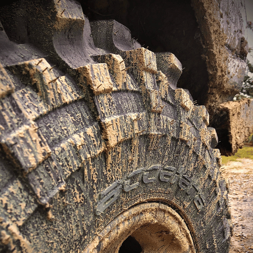 Tire Streets Accelera Badak X-Treme Ultra Aggressive Mud Terrain Tire close up very dirty