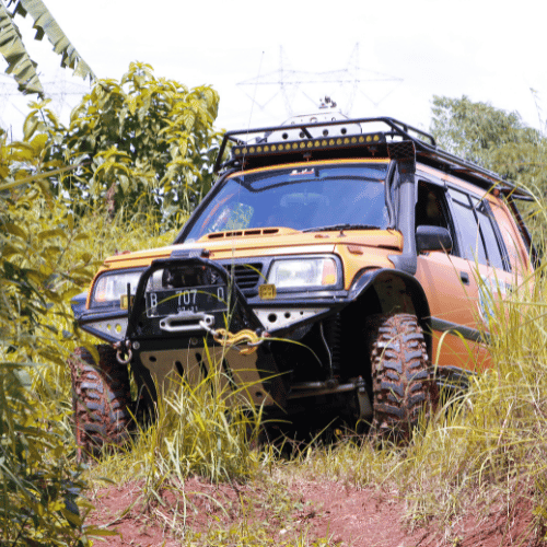Tire Streets Accelera Badak X-Treme aggressive mud terrtain tire on jeep in the woods
