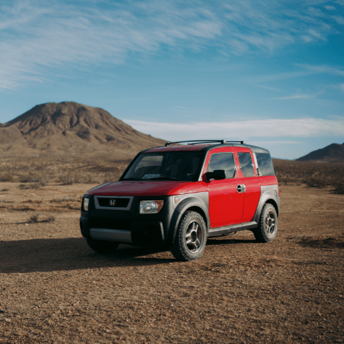 Tire Streets Accelera Omikron CT All Terrain Light Truck Tire on a red honda element in the desert