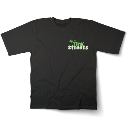 Front view of a T-shirt with 'Tire Streets' written in puffy smoke-style text, combining automotive branding with a playful 420-inspired design.